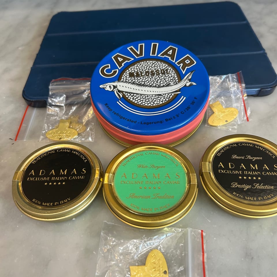 Various tins of Adamas Italian caviar, including Malossol, White Sturgeon, and Baeri Sturgeon.
